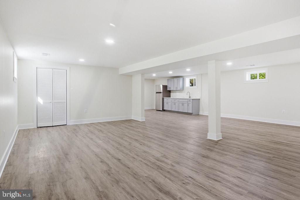 6620 Napoli Road Temple Hills, MD 20748 - Photo 22 of 38 a view of empty room with wooden floor
