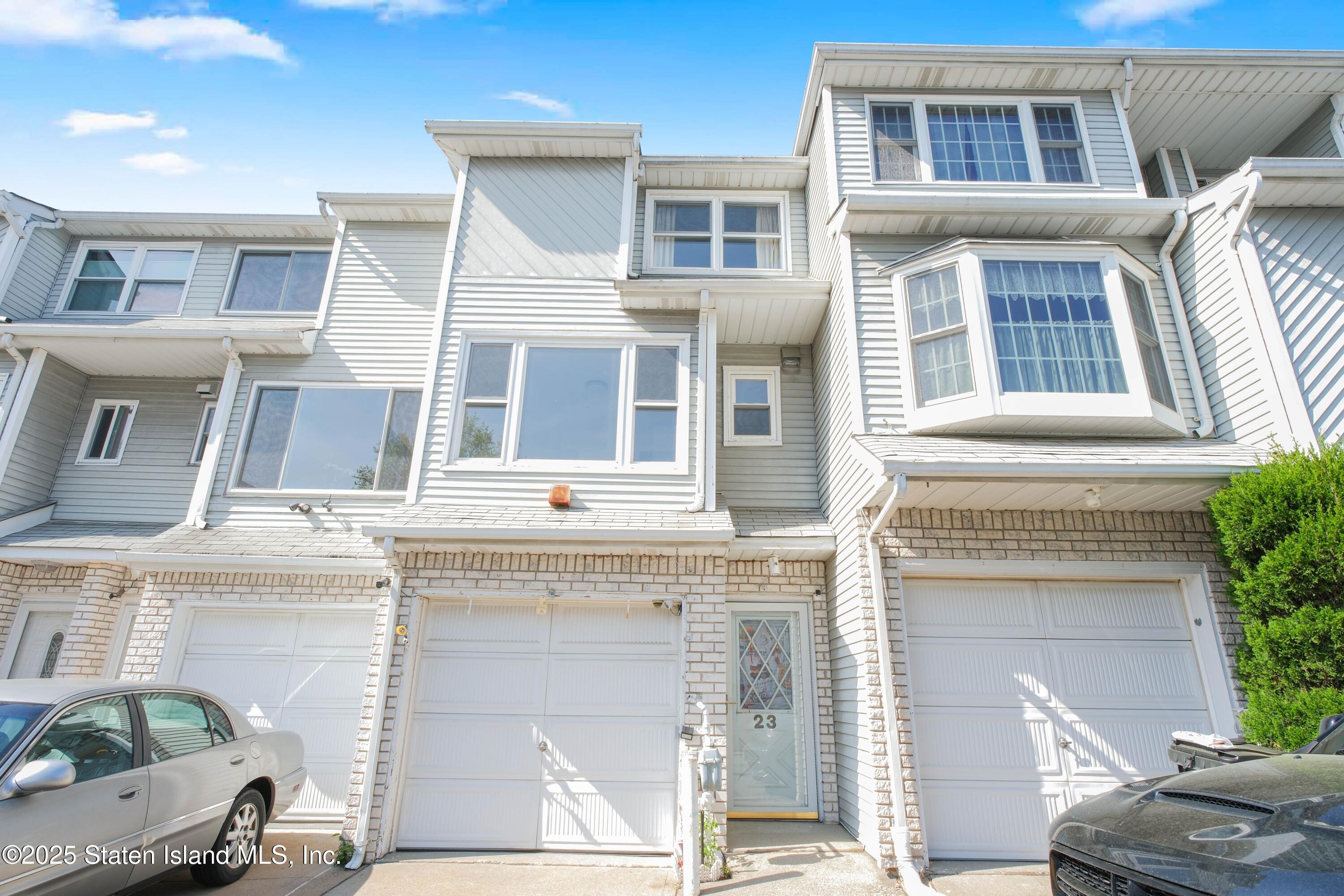a view of a building with a windows and car parked