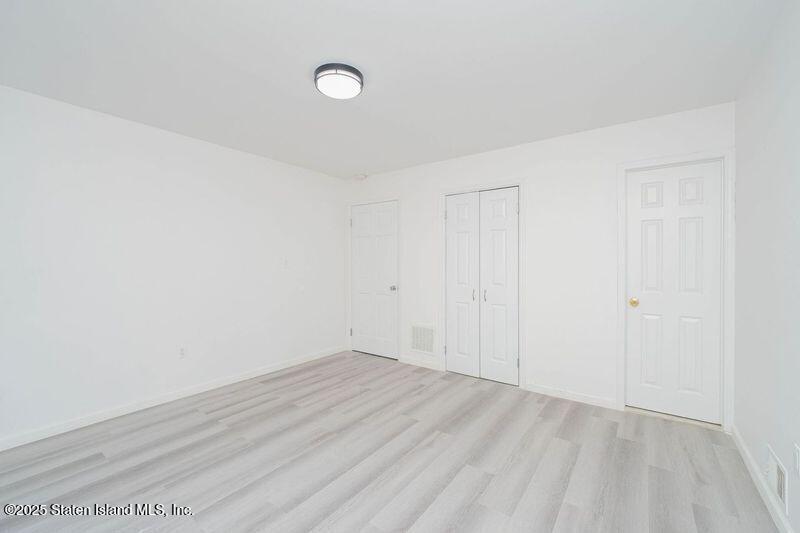 23 Vogel Loop Staten Island, NY 10314 - Photo 19 of 24 a view of an empty room