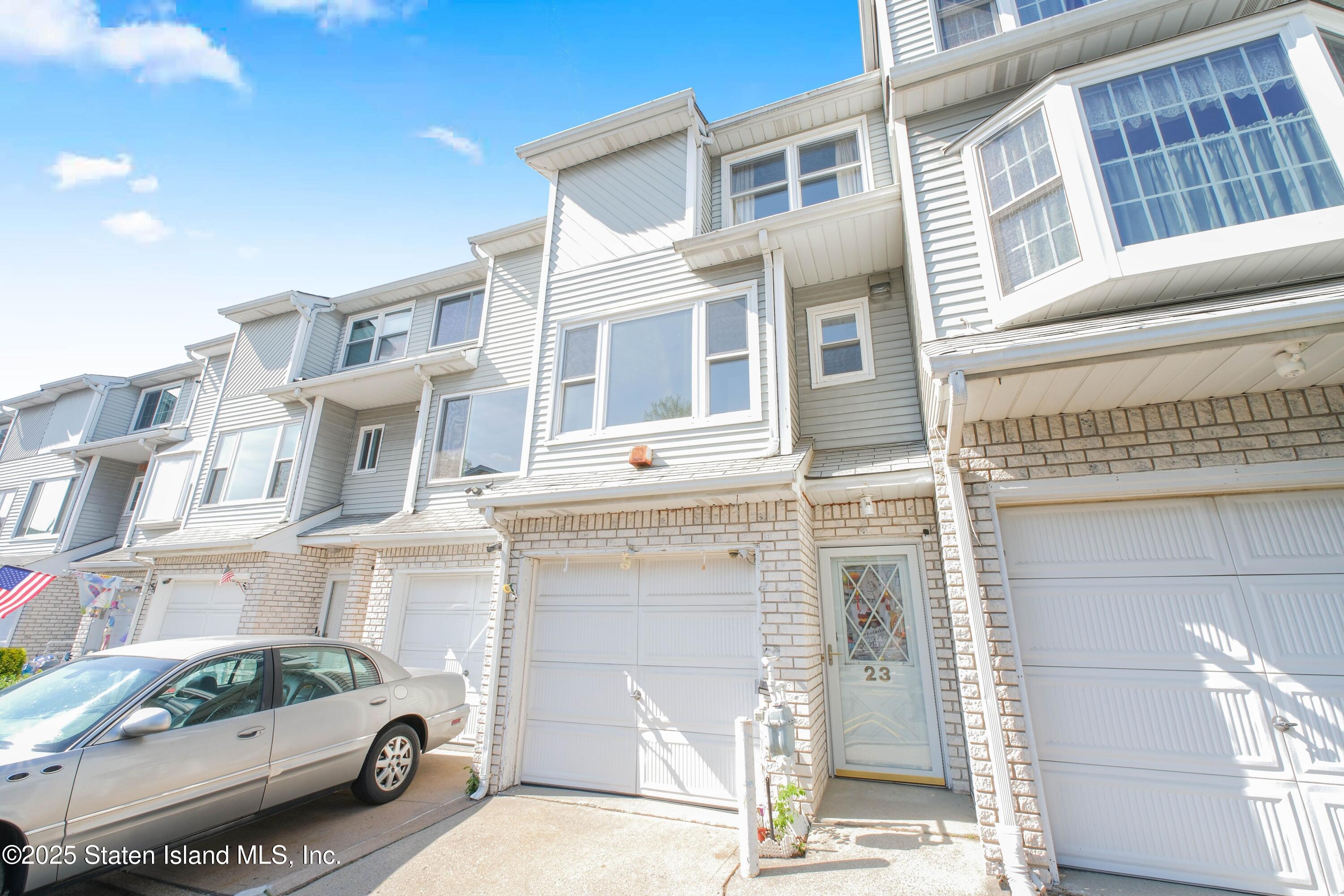 23 Vogel Loop Staten Island, NY 10314 - Photo 2 of 24 a building with multiple windows