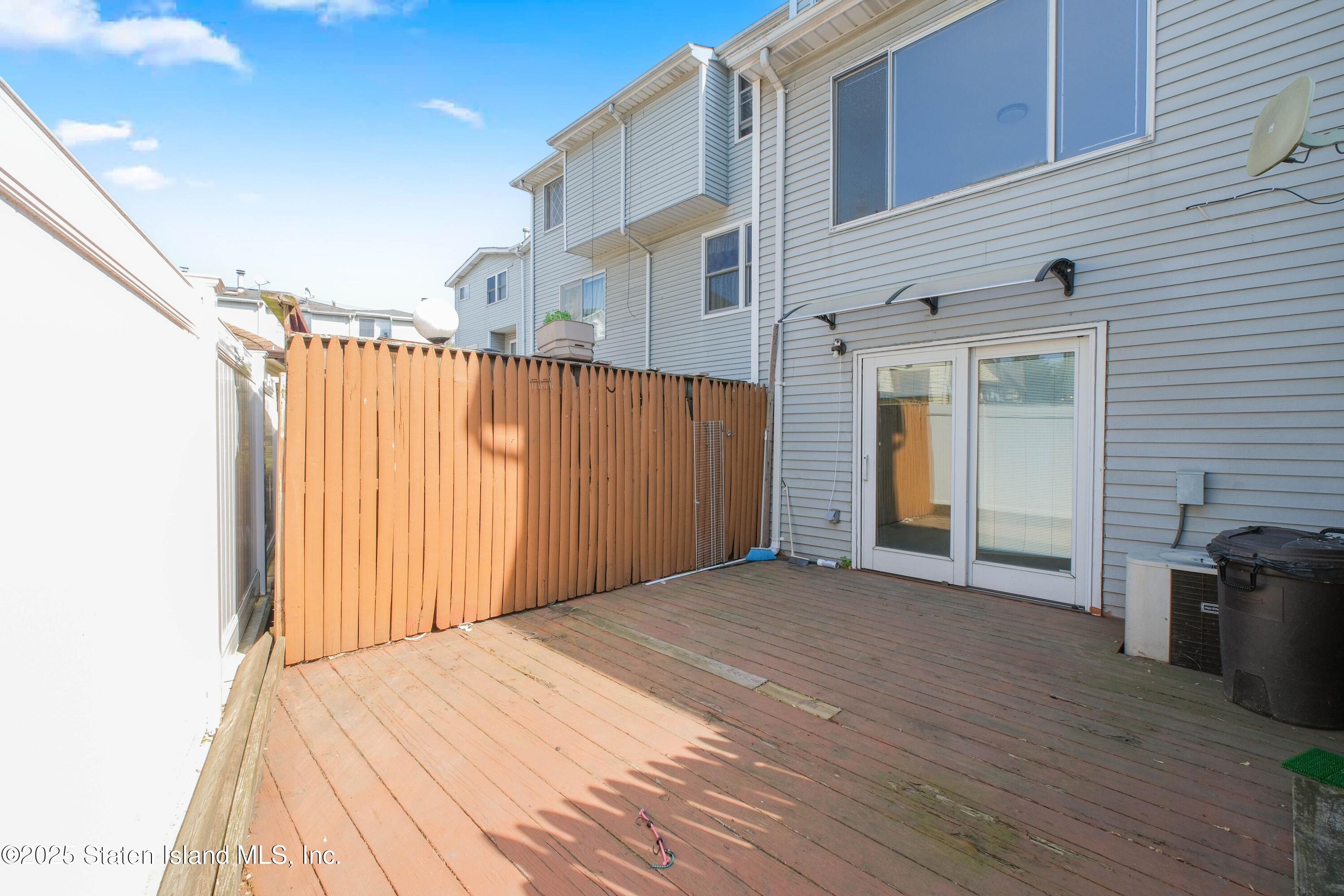23 Vogel Loop Staten Island, NY 10314 - Photo 23 of 24 a view of a backyard with wooden fence