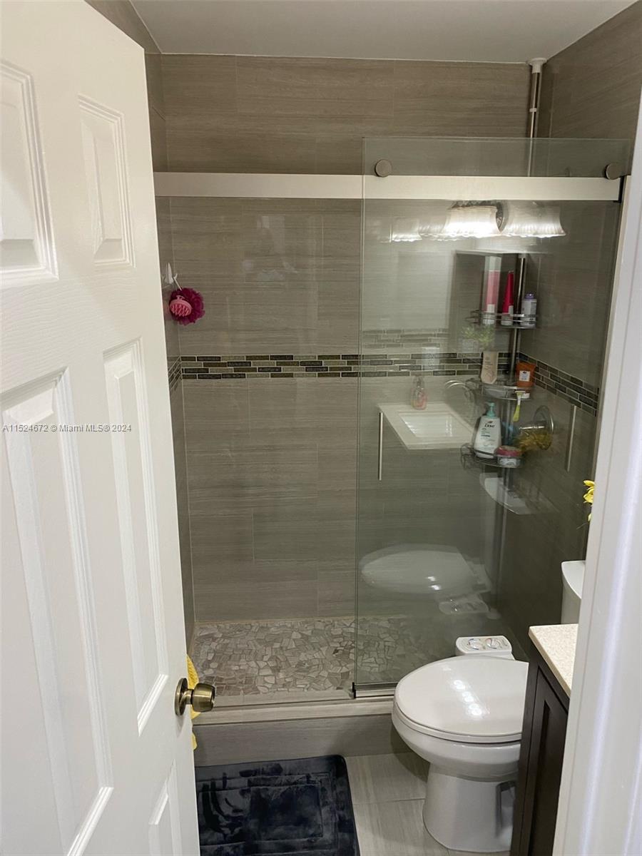 Goulds Miami, FL 33177 - Photo 15 of 18 a bathroom with a shower and a toilet