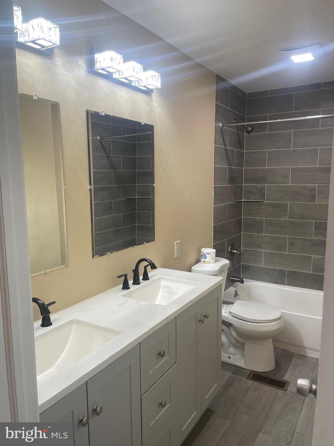 6 Vernon Court Sicklerville, NJ 08081 - Photo 17 of 31 a bathroom with a double vanity sink mirror and toilet