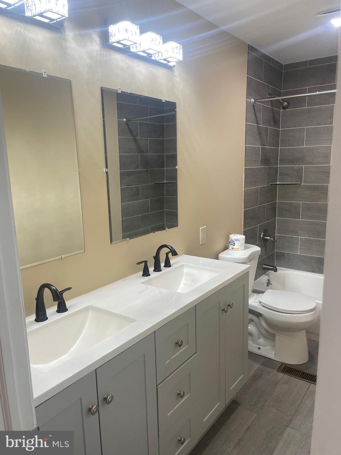 6 Vernon Court Sicklerville, NJ 08081 - Photo 19 of 31 a bathroom with a double vanity sink toilet and a mirror