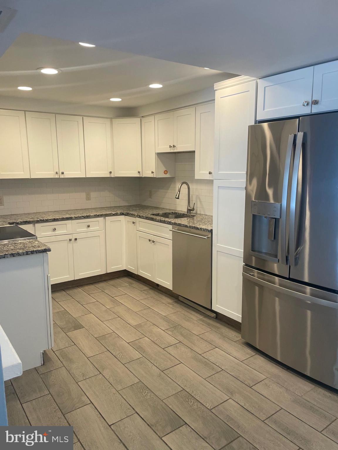 6 Vernon Court Sicklerville, NJ 08081 - Photo 2 of 31 a kitchen with granite countertop stainless steel appliances and white cabinets