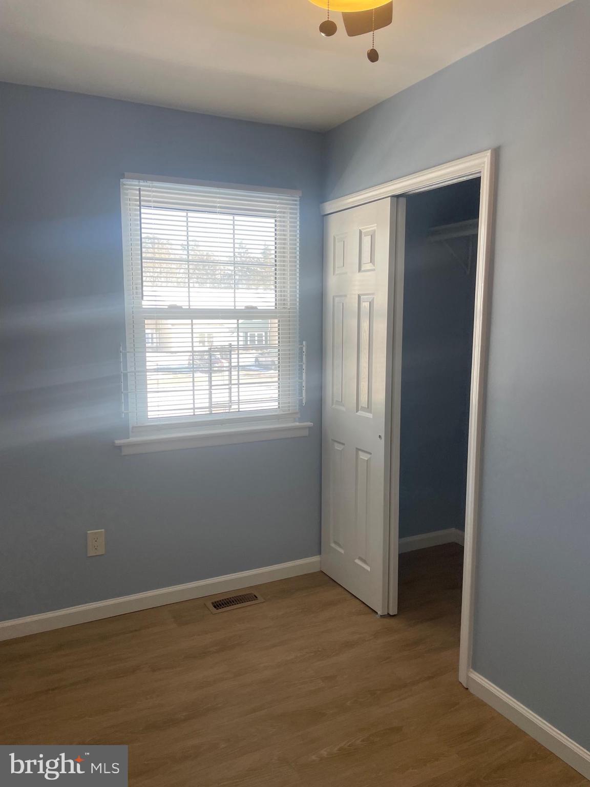 6 Vernon Court Sicklerville, NJ 08081 - Photo 21 of 31 an empty room with wooden floor and windows