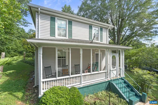 a view of a house with a window and a yard