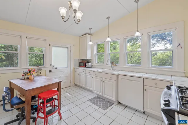 a kitchen with a sink stove and window