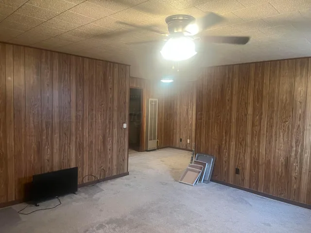 a view of a room with a wooden walls