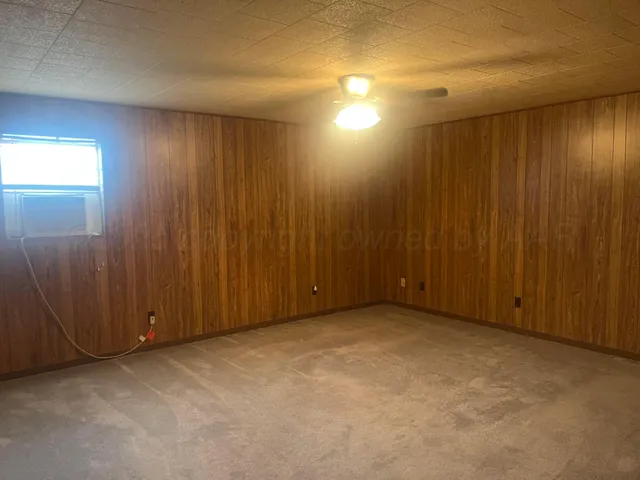 an empty room with a wooden door