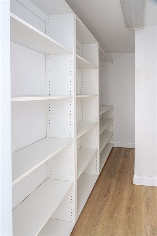 1364 High Street, Unit 1 Westwood, MA 02090 - Photo 13 of 16 a view of walk in closet with empty racks