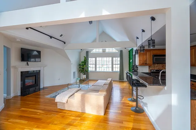 a spacious bedroom with a bed and a flat screen tv