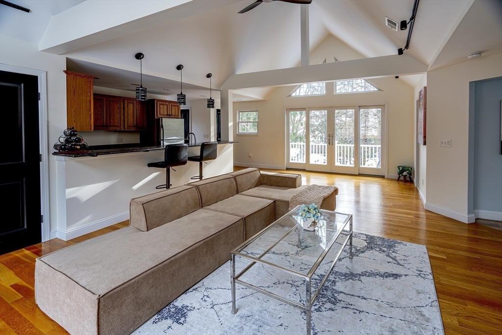 1364 High Street, Unit 1 Westwood, MA 02090 - Photo 4 of 16 a living room with furniture and a flat screen tv