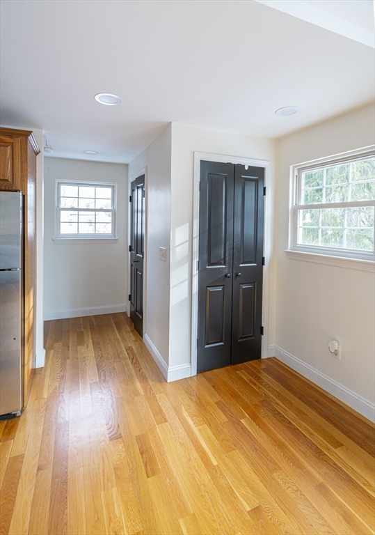 1364 High Street, Unit 1 Westwood, MA 02090 - Photo 8 of 16 a view of a room with wooden floor and a window