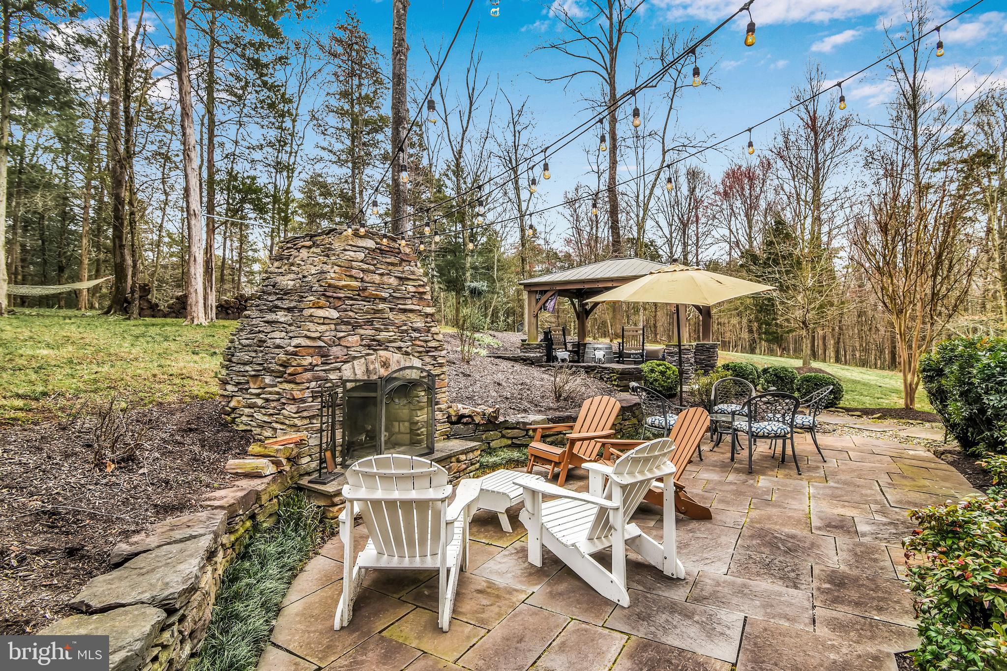 15321 Riding Club Drive Haymarket, VA 20169 - Photo 68 of 98 Stacked stone wall and fireplace