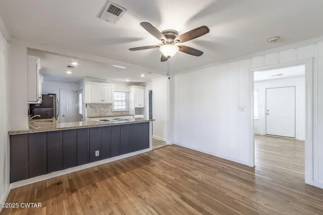 a kitchen with a wooden cabinets and sink
