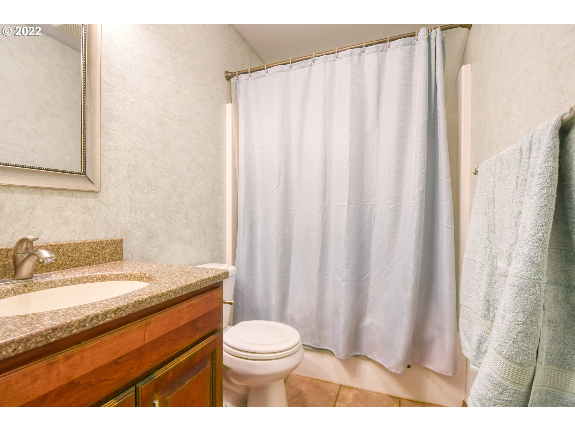 3225 Southwest Hailey Avenue Pendleton, OR 97801 - Photo 20 of 29 a bathroom with a granite countertop sink and a mirror