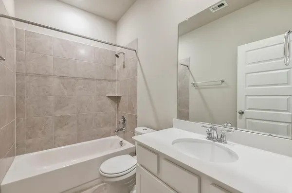 a bathroom with a sink a toilet and a bathtub