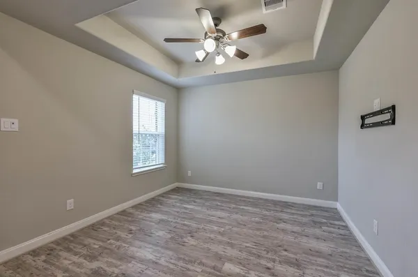 a view of an empty room with a window