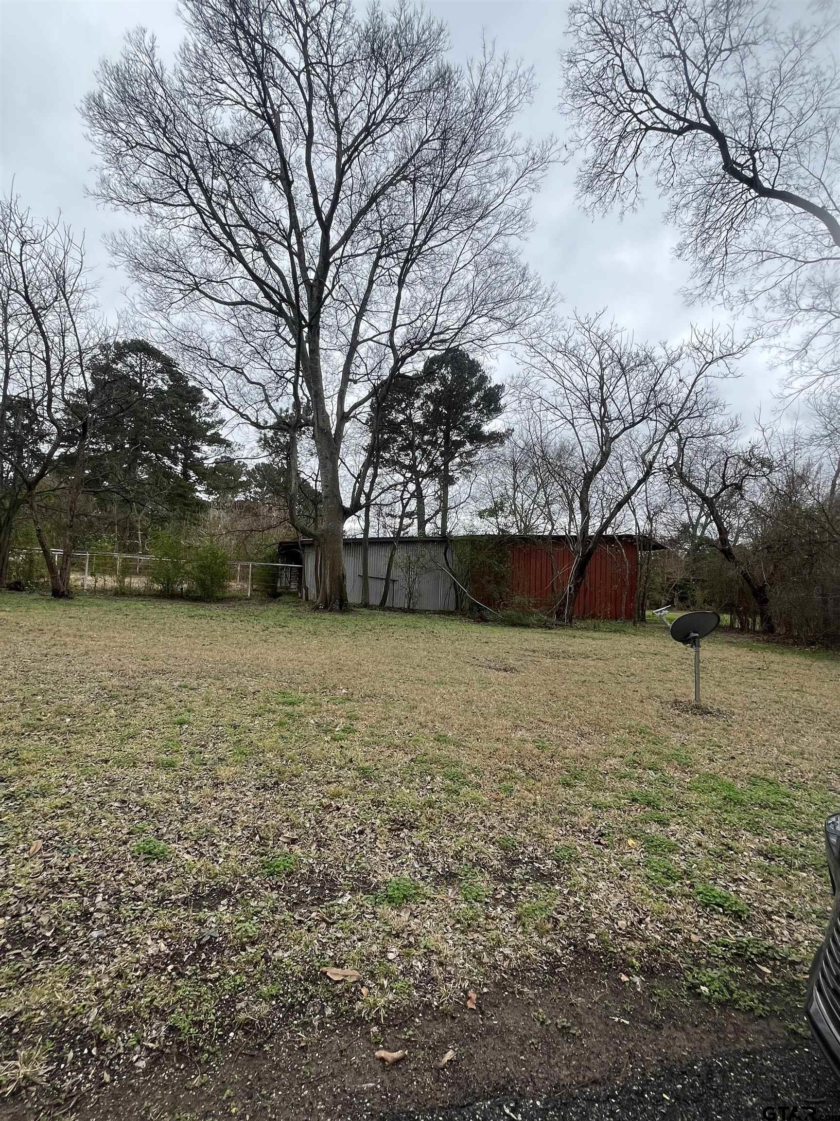 3614 Stone Road Kilgore, TX 75662 - Photo 4 of 8 a backyard of a house with lots of green space