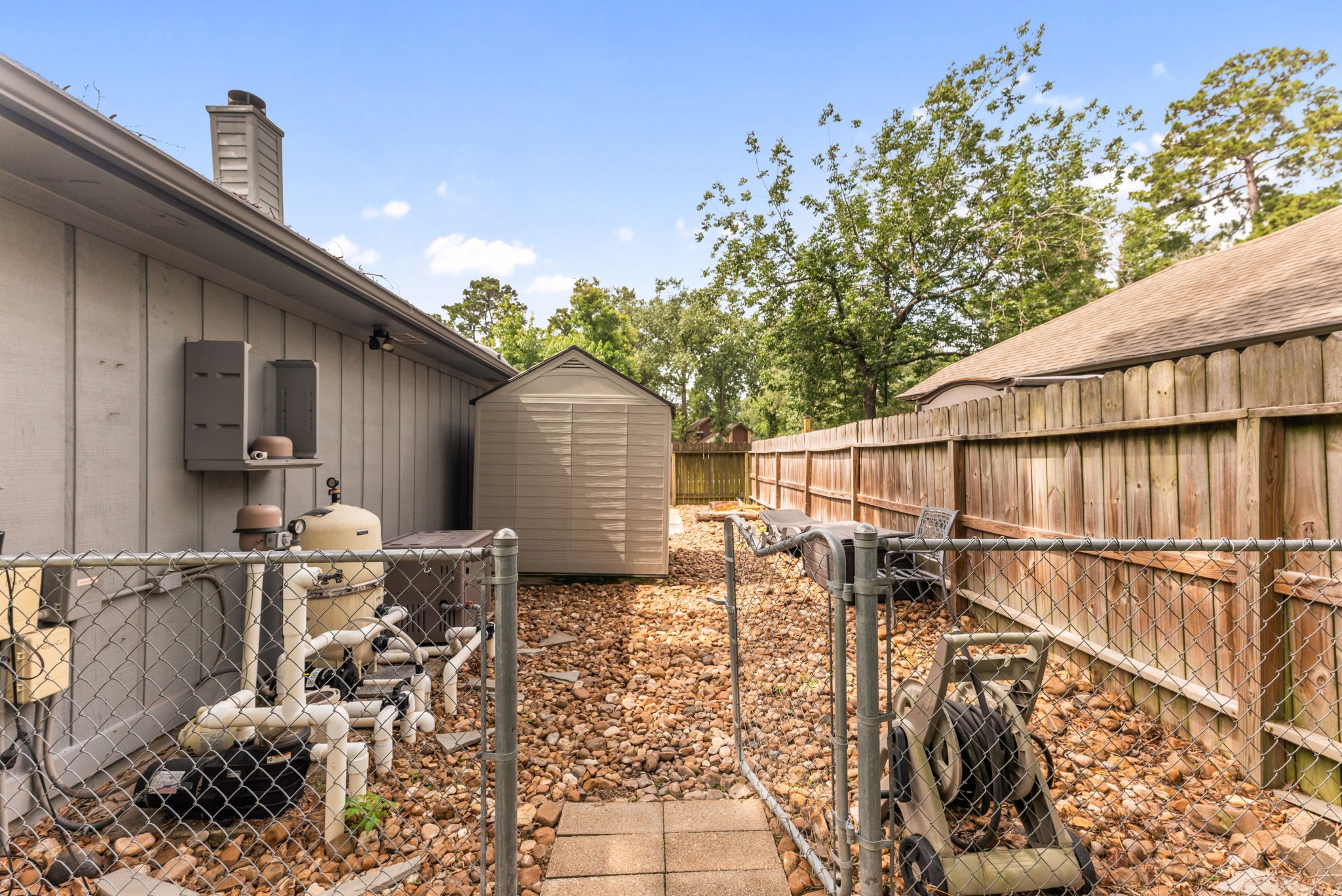 1915 Mercoal Drive Spring, TX 77386 - Photo 34 of 50 Convenient side yard with gated access and additional outdoor space.