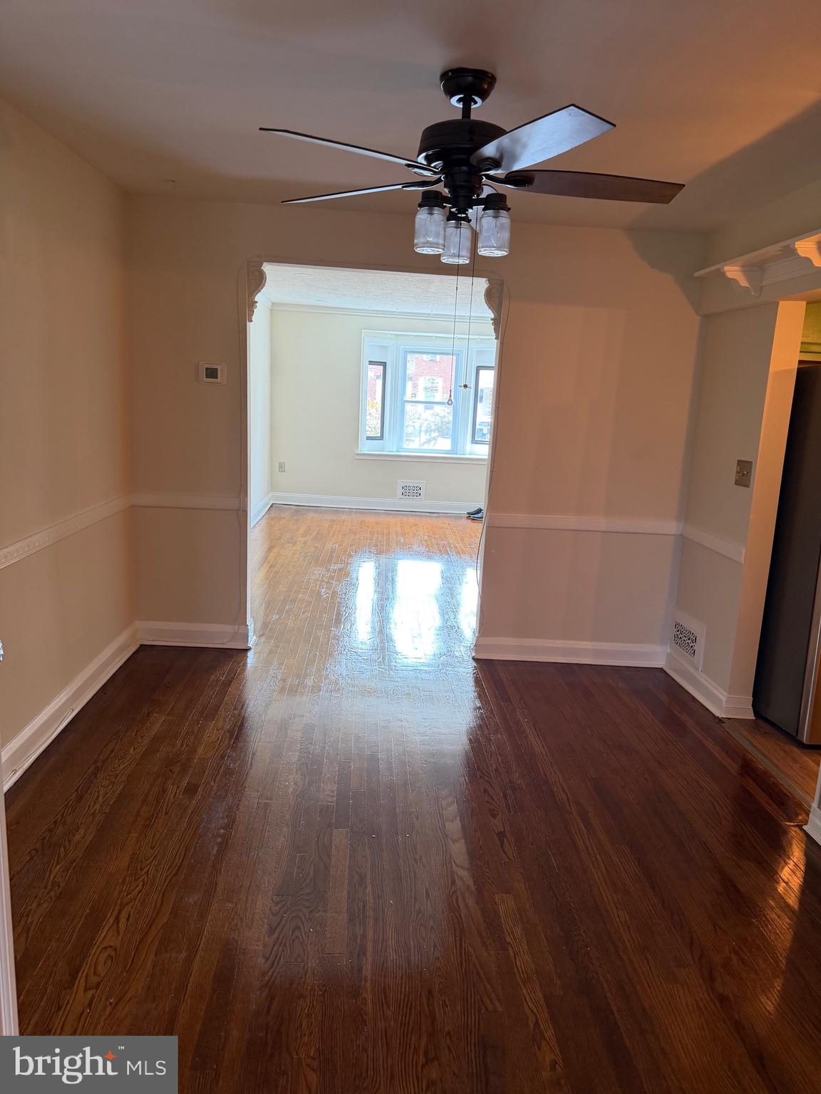 1930 Frames Road Dundalk, MD 21222 - Photo 9 of 30 a view of empty room with wooden floor and fan