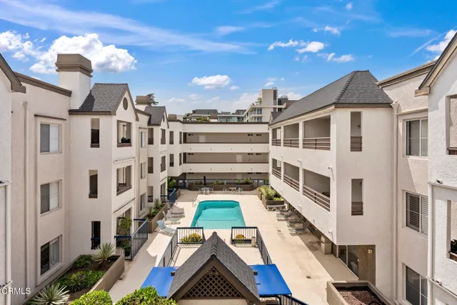 a living room with furniture and a lamp