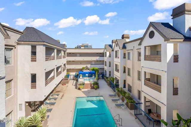 a kitchen with stainless steel appliances granite countertop a sink and a stove