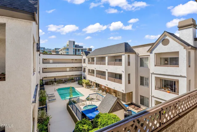 a kitchen with stainless steel appliances granite countertop a stove a refrigerator and a microwave