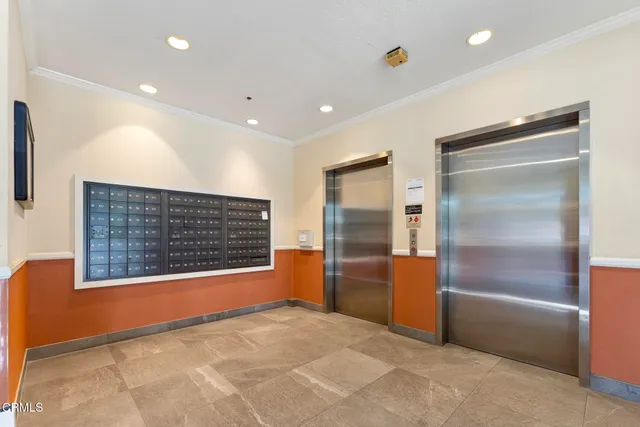 a kitchen with granite countertop a sink a stove and cabinets