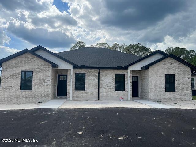687 South Orange Street Starke, FL 32091 - Photo 1 of 13 a backyard of a house with table and chairs