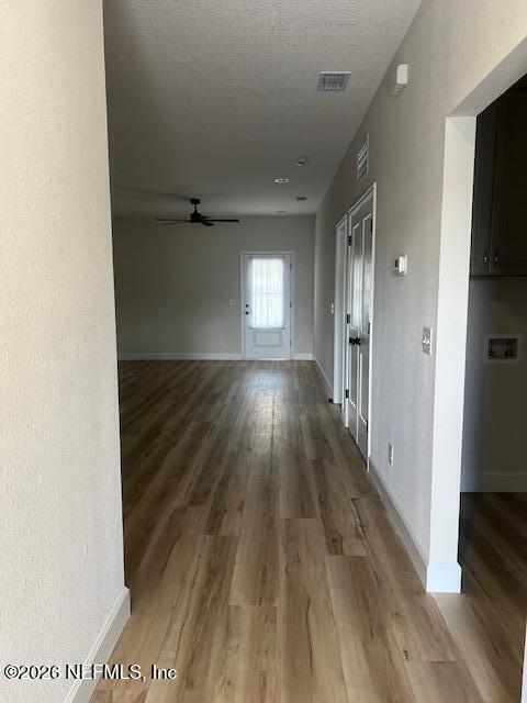 687 South Orange Street Starke, FL 32091 - Photo 2 of 13 a view of a hallway with wooden floor