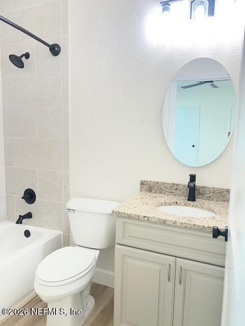 687 South Orange Street Starke, FL 32091 - Photo 9 of 13 a bathroom with a granite countertop toilet sink and mirror