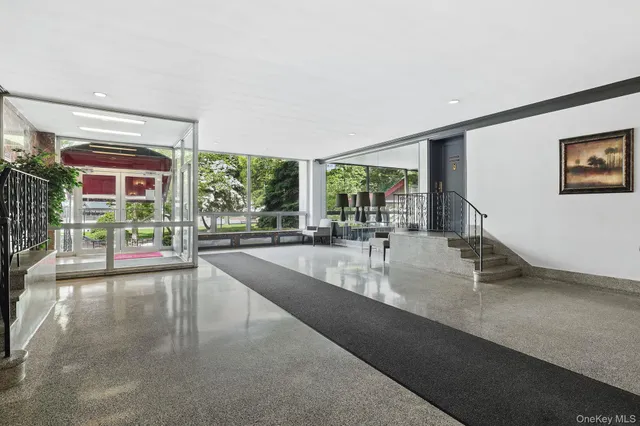 a kitchen with stainless steel appliances a sink and a large window