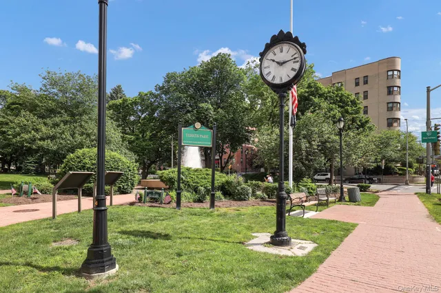 a view of a fountain in the backyard of house