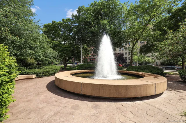a view of outdoor space with seating area and car parked