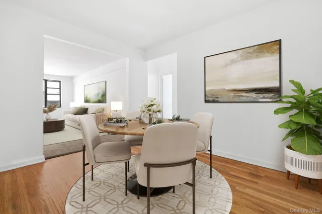 a view of a livingroom with furniture and a potted plant