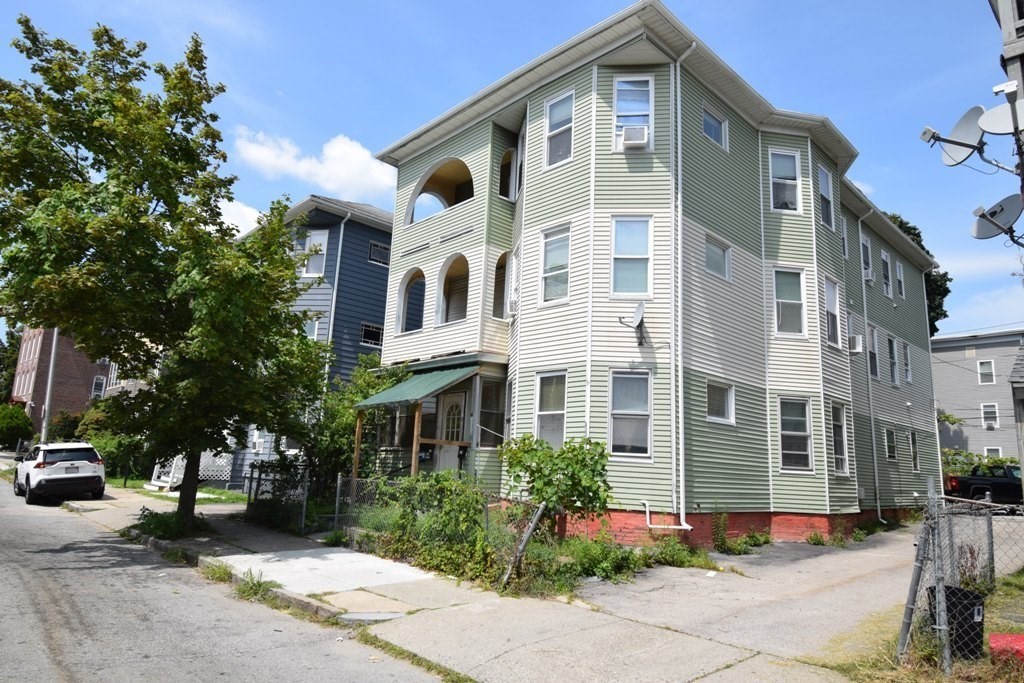 6 Pelham Street Worcester, MA 01609 - Photo 19 of 23 a front view of a house with a yard