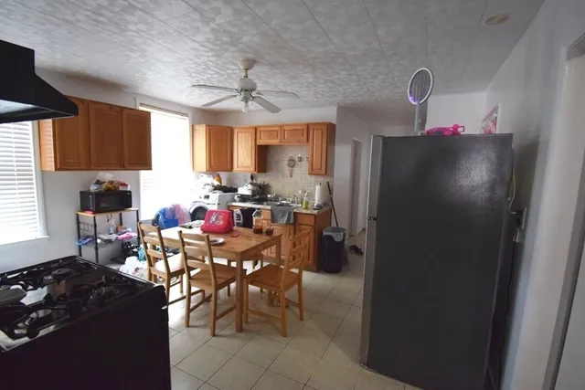 a view of a kitchen and dining room