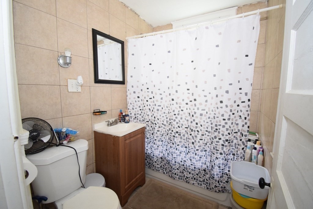6 Pelham Street Worcester, MA 01609 - Photo 4 of 23 a bathroom with a sink toilet and shower