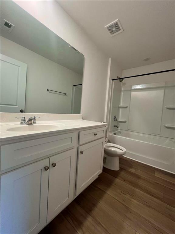 683 Evergreen Road Winder, GA 30680 - Photo 35 of 37 a bathroom with a granite countertop sink toilet a mirror and shower