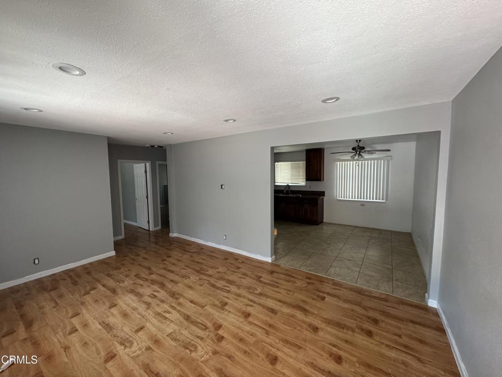 15624 Vanowen Street Van Nuys, CA 91406 - Photo 4 of 13 a view of empty room with wooden floor