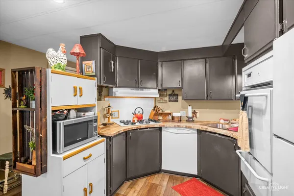 a kitchen with a sink stove and refrigerator