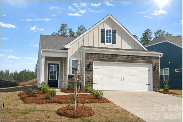 1877 Bentwind Road, Unit 329 Lancaster, SC 29720 - Photo 1 of 1 a front view of a house with a yard