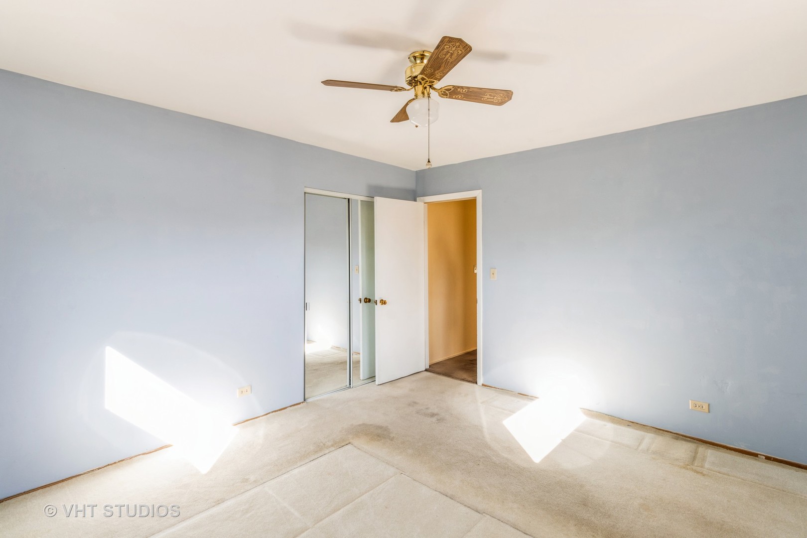 75 Carthage Lane Hoffman Estates, IL 60169 - Photo 26 of 33 a view of a room with a ceiling fan and a rug