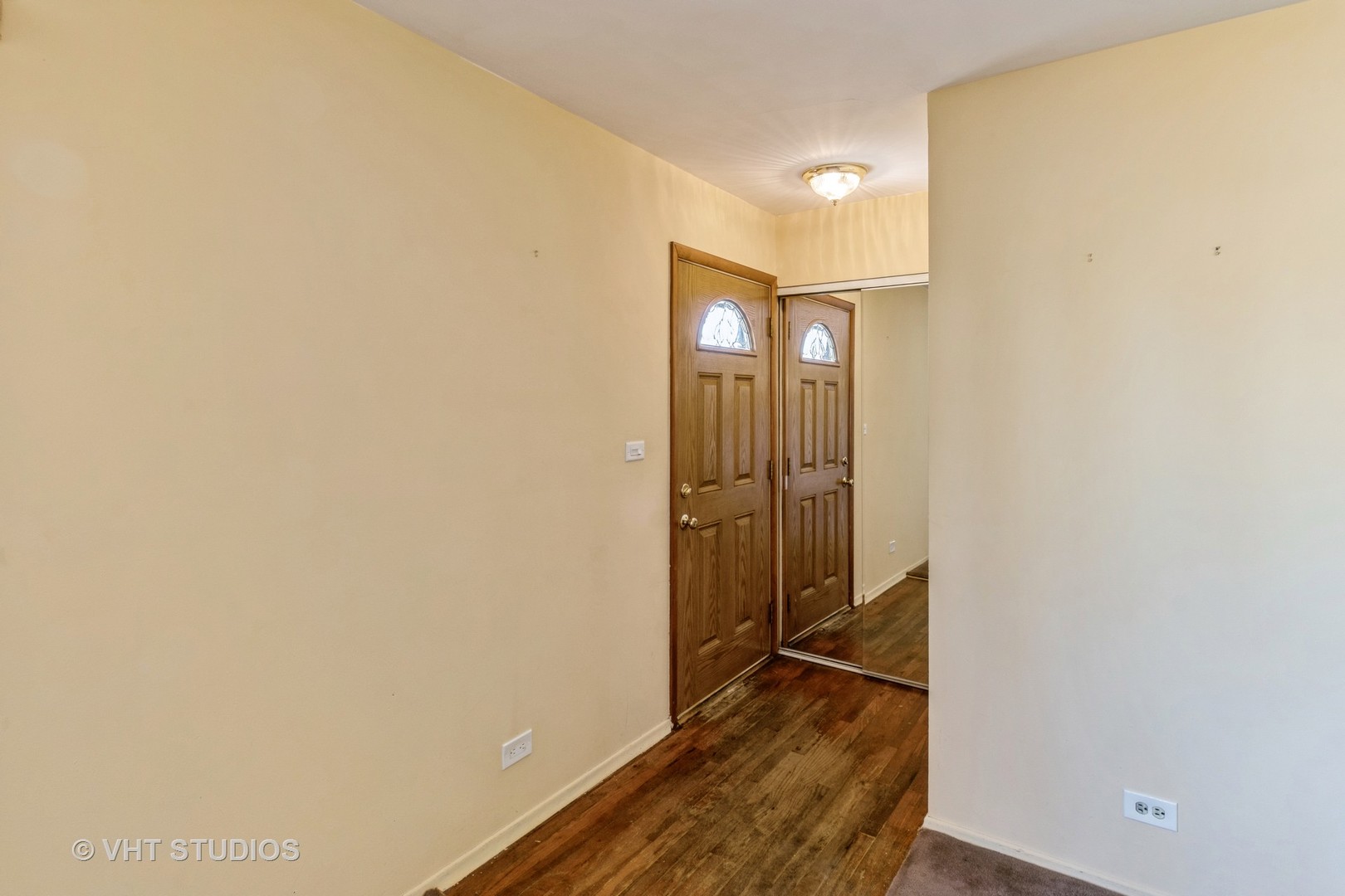 75 Carthage Lane Hoffman Estates, IL 60169 - Photo 3 of 33 a view of a hallway with wooden floor and a bathroom
