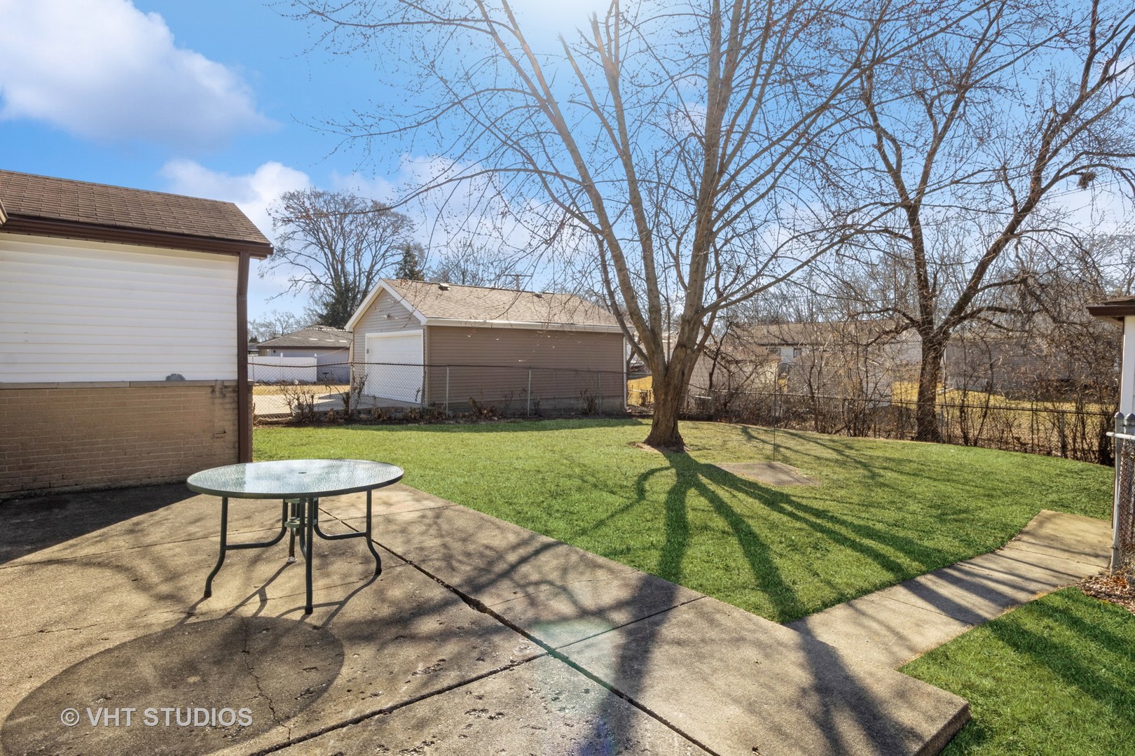 75 Carthage Lane Hoffman Estates, IL 60169 - Photo 31 of 33 a view of a backyard with chair and table