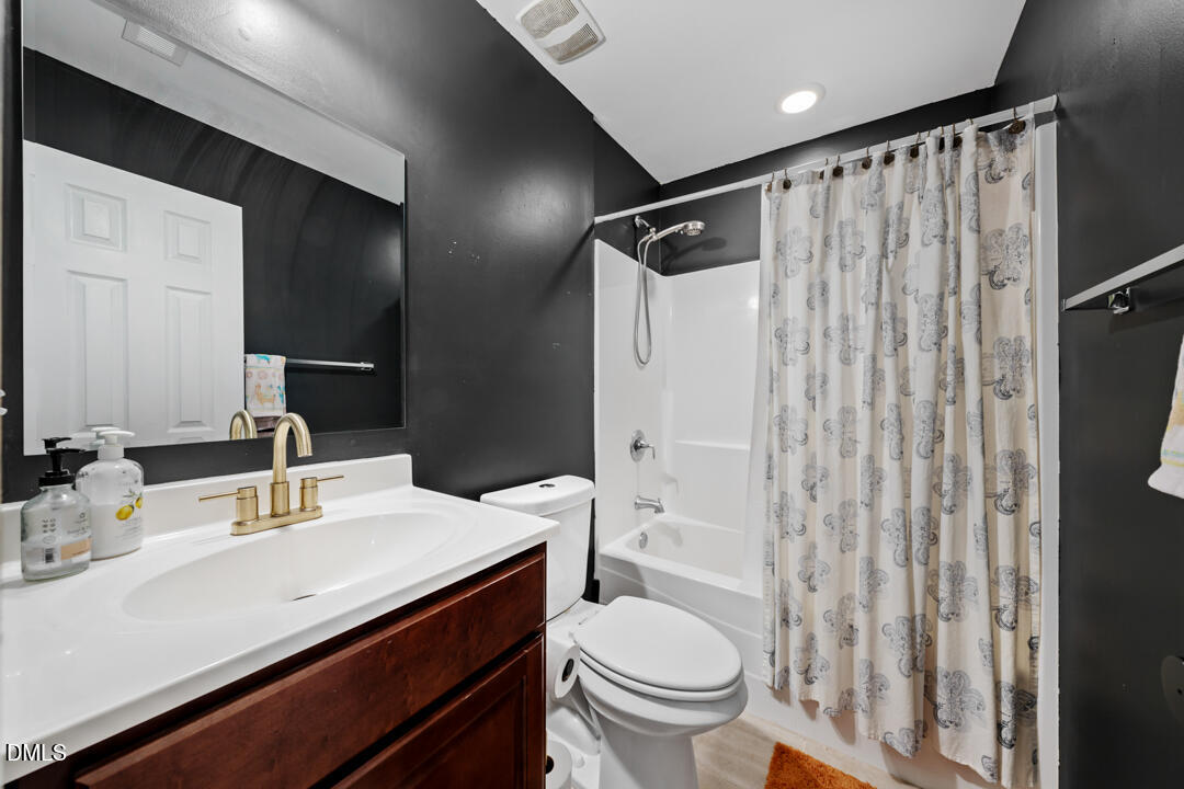806 South Roxboro Street Durham, NC 27707 - Photo 12 of 25 a bathroom with a sink toilet and shower