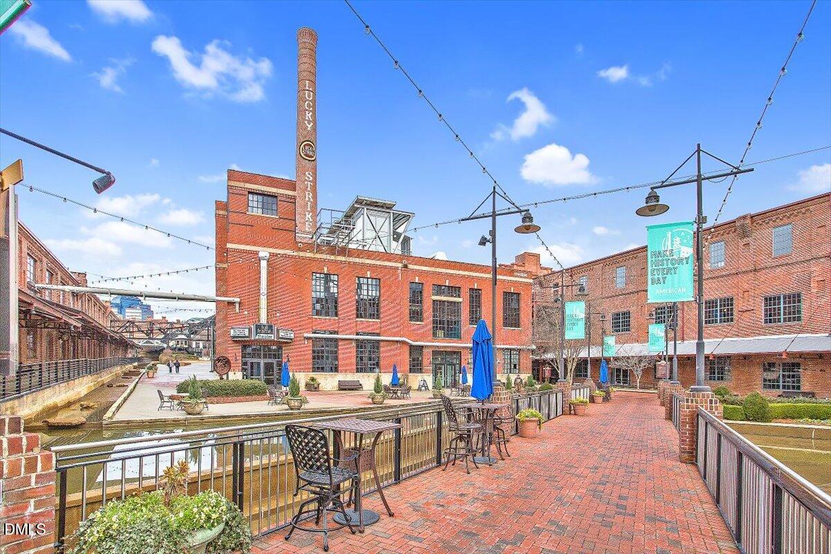 806 South Roxboro Street Durham, NC 27707 - Photo 17 of 25 a city street filled with lots of tall buildings