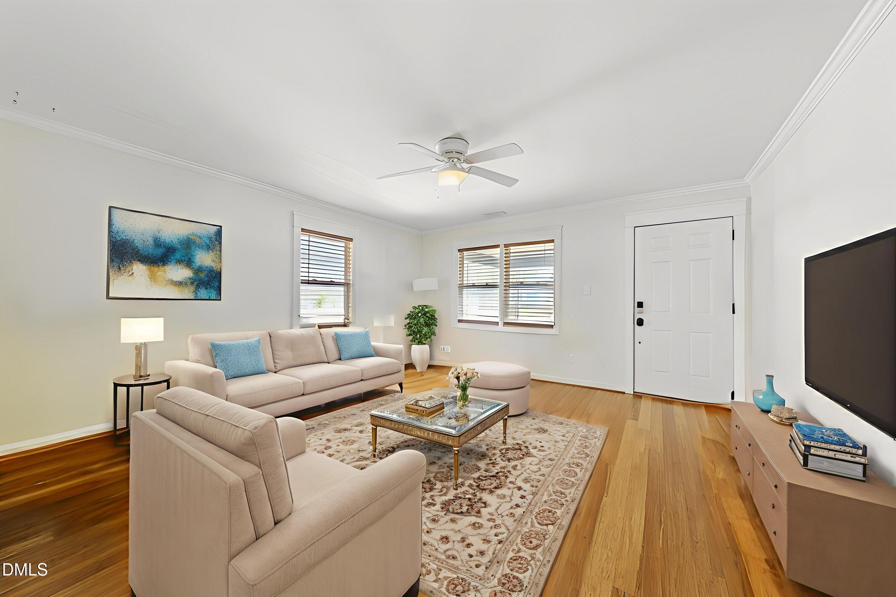 806 South Roxboro Street Durham, NC 27707 - Photo 5 of 25 a living room with furniture a flat screen tv and a window